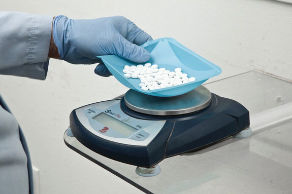 Throughout production, QC and our trained machine operators randomly test compressed tablets to ensure the weights are being met during tablet compression